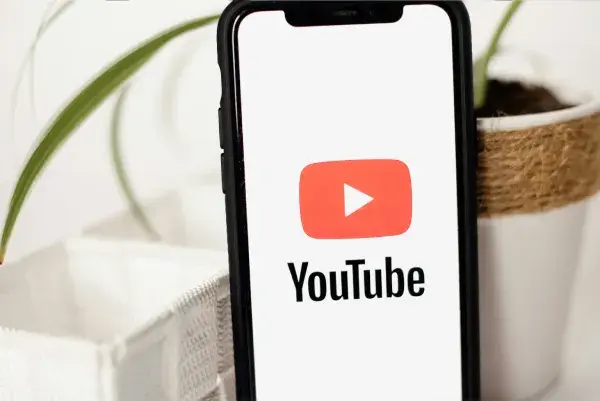 YouTube logo on phone screen