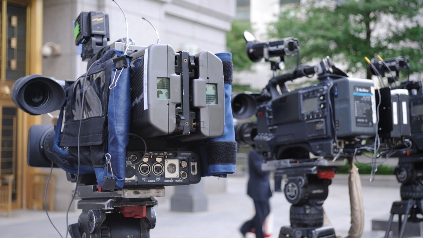 video cameras poised outside of a courthouse